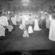 Interior view of the Daniels and Fisher store in Denver, Colorado; shows the "French Room," mannequins in lace and brocade gowns, mirrors and a doll.