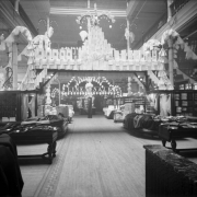 Interior view of the Daniels and Fisher store in Denver, Colorado; shows displays of fabric and clothing. Sign reads: "Linen Sale."