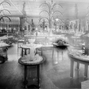 Interior view of the Daniels and Fisher store in Denver, Colorado; shows displays of crystal, glass, and lamps.