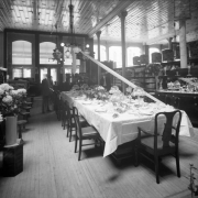 Interior view of the Daniels and Fisher store in Denver, Colorado; shows displays of dinnerware, flowers, and lamps.