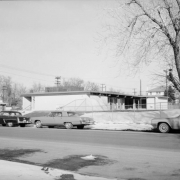 George Washington Carver Day Nursery at 2270 Humboldt St. on the corner of 23rd and Humboldt Street in Denver, Colorado.  Cars are parked on Humboldt Street.