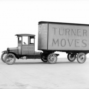View of a truck and trailer in Denver, Colorado; lettering reads: "Turner Moves - The Turner Moving and Storage Co."