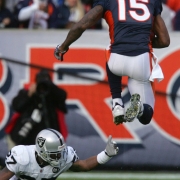 (683) Brandon Marshall jumps over Rashad Baker in the first quarter of the Denver Broncos against the Oakland Raiders at Invesco Field at Mile High in Denver, Colo., on Sunday, Nov. 23, 2008. (CHRIS SCHNEIDER/ROCKY MOUNTAIN NEWS) **