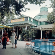 A mother walks with her son and daughter near the theater at Elitch Gardens in the West Highland neighborhood of Denver, Colorado. A sign on the theater reads: "Elitch Gardens' Players Theatre Change of Play Weekly."
