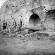 View of Long House Ruin, Native American (Anasazi) talus cliff dwelling, at Bandelier National Monument, New Mexico. Ladders lean against the tuff dwellings which have holes for vigas.