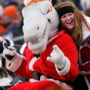 (1613) A fan gets her picture taken with Miles in the third quarter of the Denver Broncos against the Buffalo Bills at Invesco Field at Mile High in Denver., Colo., on Sunday, Dec. 21, 2008. Th Broncos lost 30-23. (CHRIS SCHNEIDER/ROCKY MOUNTAIN NEWS) **