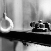 View of a window latch at 1325 Poplar Street in Denver, Colorado.