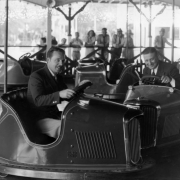 Eddie Brittain and Tom Gerun, members of an orchestra at Lakeside Amusement Park in Lakeside (Jefferson County), Colorado, pose in bumper cars.
