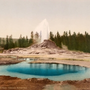 View of Castle Geyser in the process of eruption and a hot spring pool in Upper Geyser Basin, Yellowstone National Park, Wyoming.