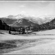 View across undeveloped meadow, Estes Park, Colorado towards Longs Peak (elevation 14,255 feet) and Mount Meeker (elevation 13,911 feet); Rocky Mountain National Park, Rocky Mountains.