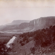 View of Seven Castles rock formation near Basalt (Eagle County), Colorado. A Colorado Midland Railway locomotive and train parallels the Fryingpan River.