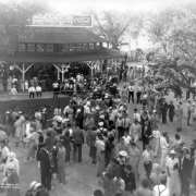 People stroll at Lakeside Amusement Park in Lakeside (Jefferson County), Colorado; a sign atop a pavilion reads: "El Patio Ballroom" and "Coca Cola."