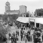 People walk by concession stands at Lakeside Amusement Park in Lakeside (Jefferson County), Colorado; the tower and theater are in the background.