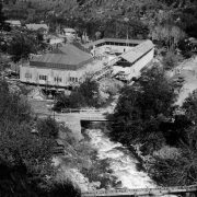 Swimming pool and clubhouse are being rebuilt after a devastating  fire in December of 1929, at the resort in Eldorado Springs, Colorado. South Boulder Creek runs adjacent to the pool.