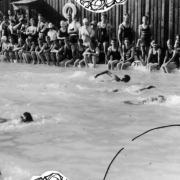 Swimmers compete in the pool at the resort in Eldorado Springs, Colorado, as onlookers watch the action.