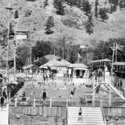 Swimmers and onlookers crowd the swimming pool area of the resort  at Eldorado Springs, Colorado.