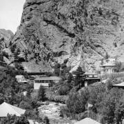 The resort at Eldorado Springs, Colorado is at the mouth of Eldorado Canyon. Sheer cliff walls mark the entrance to the canyon and the South Boulder Creek runs along the bottom.