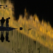 Visitors enjoy the sunset  and the reflection of the aspens in Maroon Lake Monday afternoon September 26, 2005, at the Maroon Bells in Aspen. The Maroon Bells are one of the most photographed places in Colorado during the show of color by the aspen tre...