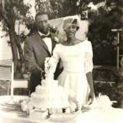 Bride Jonella Andrews and Groom Charles Johnson cut their cake after their wedding at the home of William and Leena Cotton at 2722 Fillmore Street in Denver, Colorado.  
