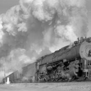 Train First #24, Grand Canyon Limited; 8 cars, 40 MPH; fine smoke effect. Photographed:  leaving Belen, N.M., January 12, 1947.