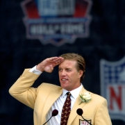 (CANTON, Ohio., SHOT 8/8/2004) As a final tribute to all the Broncos' fans, John Elway performs one final Mile High Salute Sunday at the end of his Pro Football Hall of Fame Induction speech. John Elway and the three other inductees into the Pro Footba...