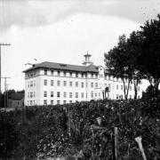 View of the J.K. Mullen Home for the Aged (later the Little Sisters of the Poor Mullen Home) at 3629 West 29th (Twenty-ninth) Avenue in the West Highland neighborhood of Denver, Colorado. Shows a four story neoclassical building with cupola and portico.