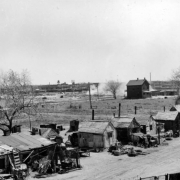 View of makeshift houses and shanties at 19th (Nineteenth) and Clay Streets in the Jefferson Park neighborhood of Denver, Colorado.