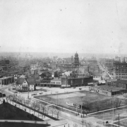 View of Civic Center and Denver, Colorado; shows the Denver Tramway Company power house, Denver Fire Department's Engine House Number One, the Imperial Apartments, the Araphahoe County Courthouse, the Kittredge Building, and the Majestic Building.