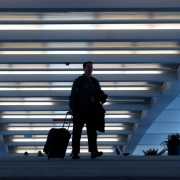 (DENVER Colo., February 15, 2005) Remster (cq) Bingham , of Boulder, walks across the sky bridge at DIA February 15, 2005. The bridge connects the Jeppesen Terminal with Concourse A. The airport is turning 10 years old February 28, 2005. (Photo by KEN ...