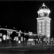Main entrance to "White City" at night (later called Lakeside Amusement Park), Lakeside, Colorado near Denver; night time view of illuminated Casino and Tower; summer evening.