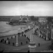 Bird's eye view of the "White City" (later called Lakeside Amusement Park), Lakeside, Colorado near Denver; Lake Rhoda, numerous rows of benches (bandstand not in view), rink, boat house, ball room and miniature train ride.