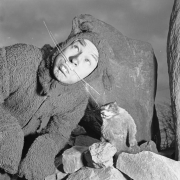 A man in a woodchuck costume poses with a taxidermy mounted groundhog in Denver, Colorado for a Cancer Society fundraiser.