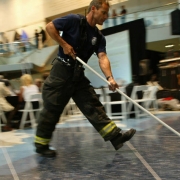 "Casino Magnifique," a benefit for Food Bank of the Rockies, at the Cable Center in Denver, Colo., on Friday, May 28, 2004.  An unidentified Denver Fire Department firefighter helps with clearing water from the tile floor inside the Cable Center after ...