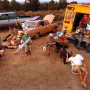 Evacuees in San Miguel County listen to music while they help maintain a roadblock.