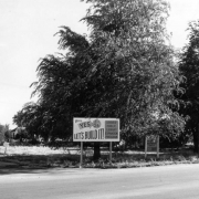 View of the site for the Hadley Branch of the Denver Public Library, at South Grove Street and West Jewell Avenue in the Mar Lee neighborhood of Denver, Colorado. Billboard reads: "Vote Yes Sept 26 Let's Build It, Denver Public Library Expansion Program."