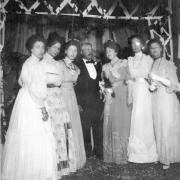 Group portrait of Denver Public Library (La Veta Place) staff at a wedding in Denver, Colorado. They are (l to r) Viva Van Allen, Irene Smith, Helen Ingersoll (DPL librarian 1898-1947), Mr. C.R. Dudley (City Librarian), Anna Hillkowitz (?), (?), and Ellen Hillkowitz. Outfits include lace and taffeta. Anna Hillkowitz is the daughter of Ella Hillkowitz and Dr. Philip Hillkowitz (one of the founders of the Jewish Consumptive Relief Society (J.C.R.S.)