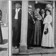 View of a woman, a ward worker, in a dark dress and hat, talking to a woman who holds a baby and stands with a young girl. Well dressed men and women sit and stand on the porch of a building with signs that reads: "Polling Place, Ward and District 9, Precinct 1" and "Election Notice." The women wear long dresses and hats. The men wear suits and hats.
