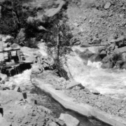 Boulder Creek flows down a series of waterfalls past a piece of mining machinery near the town of Eldorado Springs, Colorado in Boulder County.