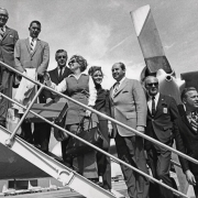 Members of the Denver Olympic Committee left for Amsterdam Monday to make Denver's showdown pitch for the 1976 Winter Olympic Games. Those who boarded King Resources plane at Stapleton were, left to right, Richard Davis, Gerald F. Groswold, Thomas Hildt, Jr., Mrs. Sidney Robbins, Brigitte Bastian, Norman Brown, Willy Schaefler and Bill Kostka, Jr. Plane left at 4 p.m.