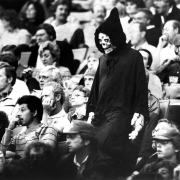 Greg Warneke on his way back to his seat at the Nuggets game. October 31, 1985. Photo by Debra Reingold. Rocky Mountain News Photograph Collection