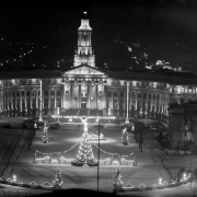 The Denver City and County Building is decorated for Christmas, Denver, Colorado. Sign reads: "Merry Christmas Happy New Year 1940."