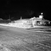 A house at 21st and Race Street, 2000 E. 21st (Twenty-first) Avenue inthe City Park West neighborhood of Denver, Colorado. The house is decorated for Christmas, the lawn is outlined with electric candles, a cross is in the yard.