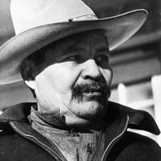 Portrait of a Mexican migrant worker in Colorado. He wears a wide-brimmed hat and jacket with a pin that reads: "CIO."