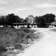 View of migrant workers' houses near Manzanola (Otero County), Colorado. A pick-up truck is parked nearby.