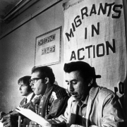 Lawyer Jonathan "Skip" Chase and Migrants in Action members Leonel Sanchez and Gregorio Salazar participate in a press conference during a protest over migrant workers' living conditions near Fort Lupton (Weld County), Colorado. Banners on the wall nearby read: "Chicano Power" and "Migrants in Action."