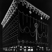 Nighttime view of the Gas and Electric Building at 15th (Fifteenth) and Champa Streets in downtown Denver, Colorado. The building is decorated with light bulbs for Christmas.