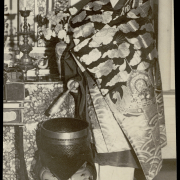 Portrait of Y. Tamai, a Buddhist monk, in Denver, Colorado; he wears a brocade robe with sunbursts and clouds.