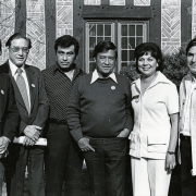 Colorado legislators Federico Peña, George Chavez, Ruben Valdez, Polly Baca-Barragán, and Richard Castro pose with United Farmworkers Union leader César Chávez (featured in center). All six individuals are wearing lapel buttons featuring the United Farmworker Union's  "Boycott Chiquita" symbol that was used in the UFW 1979 boycott. Chávez was present in Colorado to deliver several public speeches in April of that year, so this photograph was likely taken during that month.