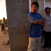 Migrant workers Isidro Escobar, 35, left, and his father, Lazaro, 68, talk about their journey to the United States from central Mexico and their life in Colorado as field workers. The two are among many who have benefited from the help offered by Munoz and the Centro San Juan Diego.