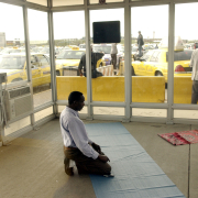 (DENVER, Colo., August 30, 2004) Abduhl Hajy, Somalia, and muslim, takes time out to pray in a make shift mosque on the property of the cabstand location allowing weather controlled area for those followers to pray. 